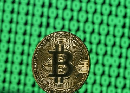 Bitcoin holds above $7,000 after hitting 9-month high