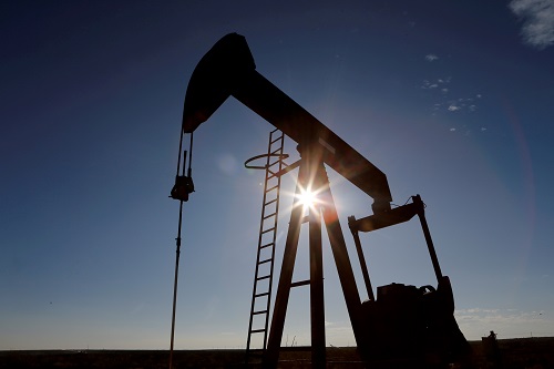Oil hits highest in a year on growth hopes, OPEC+ cuts