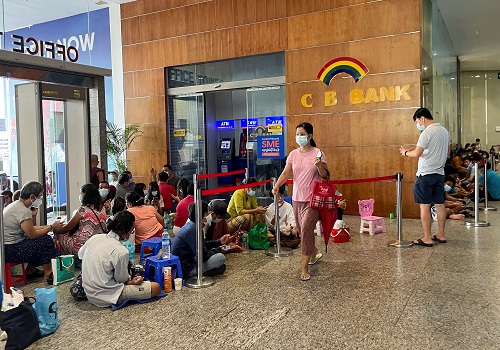 Lines, tokens and money brokers: Myanmar`s crumbling economy runs low on cash