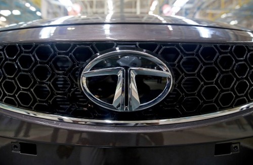 Tata Motors Ltd posted a surprise quarterly loss and took a $2.05 billion charge at the luxury Jaguar Land Rover (JLR) unit