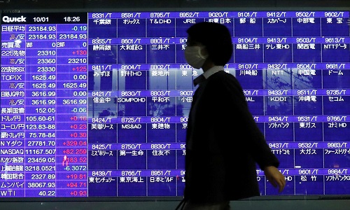 Asian shares jump on hopes for low rates, oil up on cyber attack