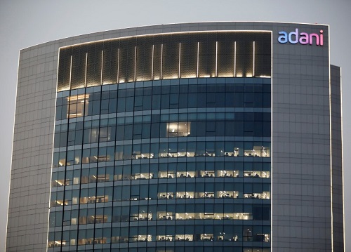 Adani shares fall on report India securities depository froze foreign funds`accounts
