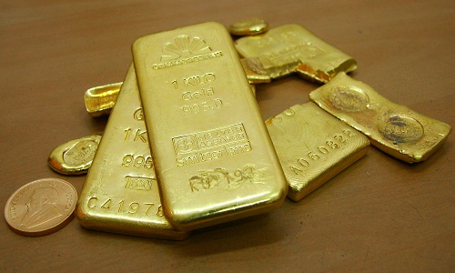 Gold dips as dollar claws up, equities firm