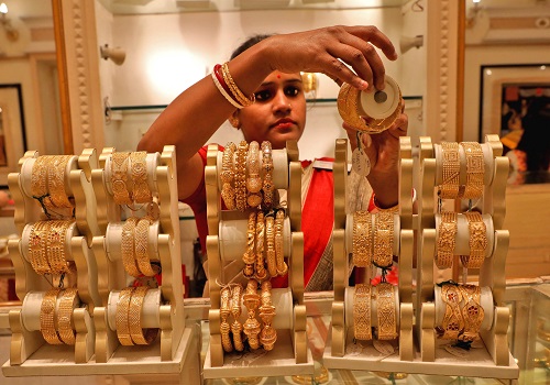 Gold prices steady after hitting 2-week high on dollar retreat