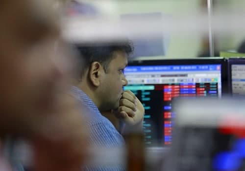 Benchmarks end volatile session marginally lower