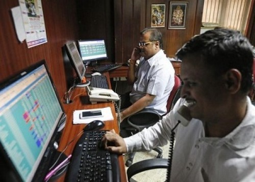 Sensex, Nifty manage to trade in green