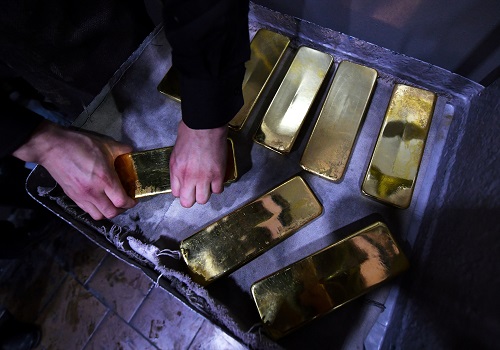 Gold slips on firm dollar, investors await Fed cues