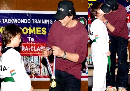 Bollywood superstar Shah Rukh Khan kisses AbRam, honours him with gold medal for winning Taekwondo tournament