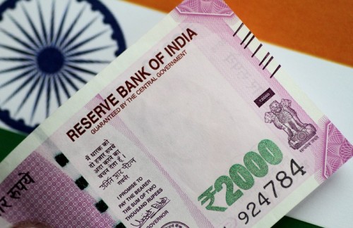 RBI intervention to keep Indian rupee in a tight range, analysts say