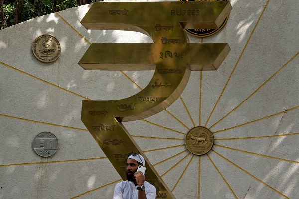 Rupee battles oil, hedging drag; RBI shield, weak dollar cushion fall