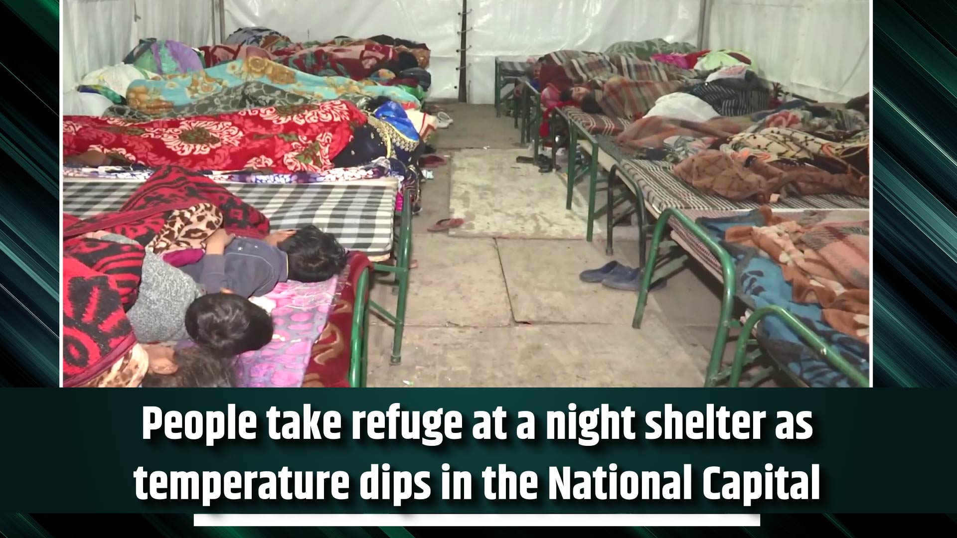 People take refuge at a night shelter as temperature dips in the National Capital