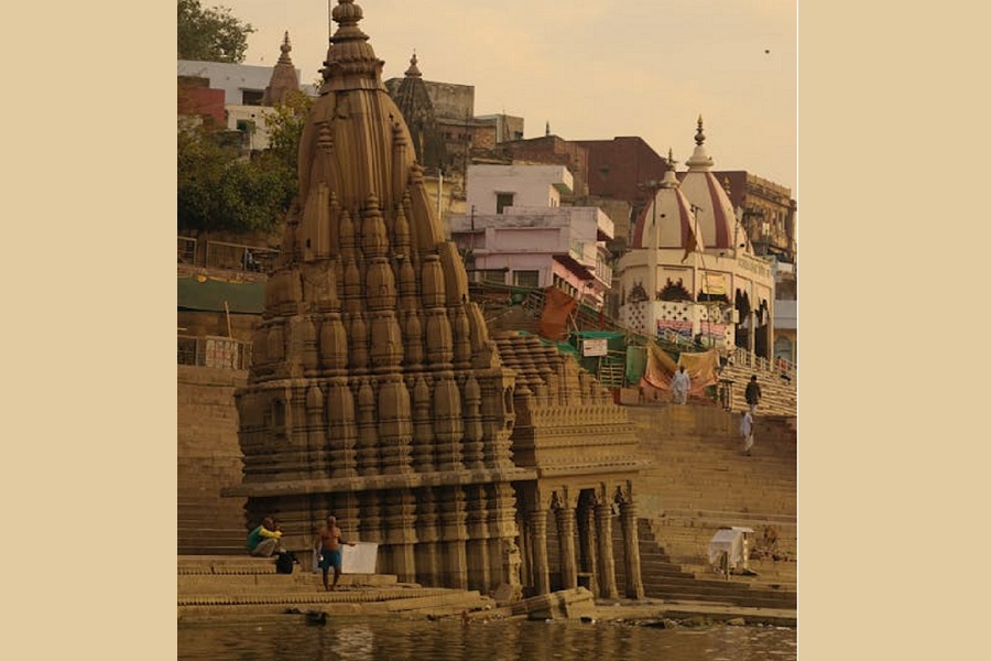 Embracing Heritage: Cultural Tourism by the Riverside Temple at Sunset