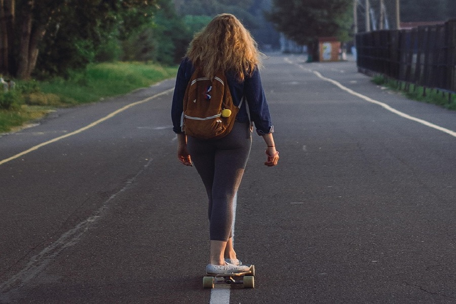 Embracing Freedom: A Girl and Her Skateboard
