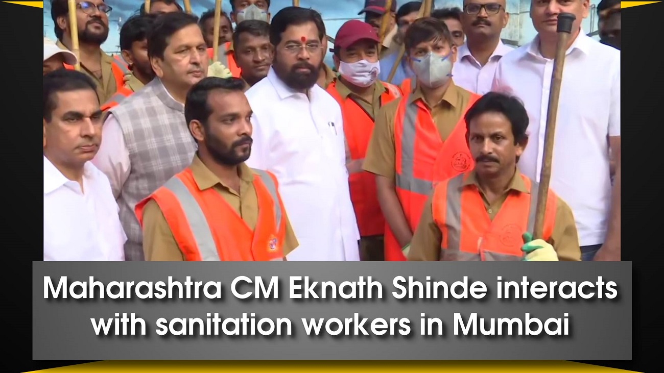 Maharashtra CM Eknath Shinde interacts with sanitation workers in Mumbai