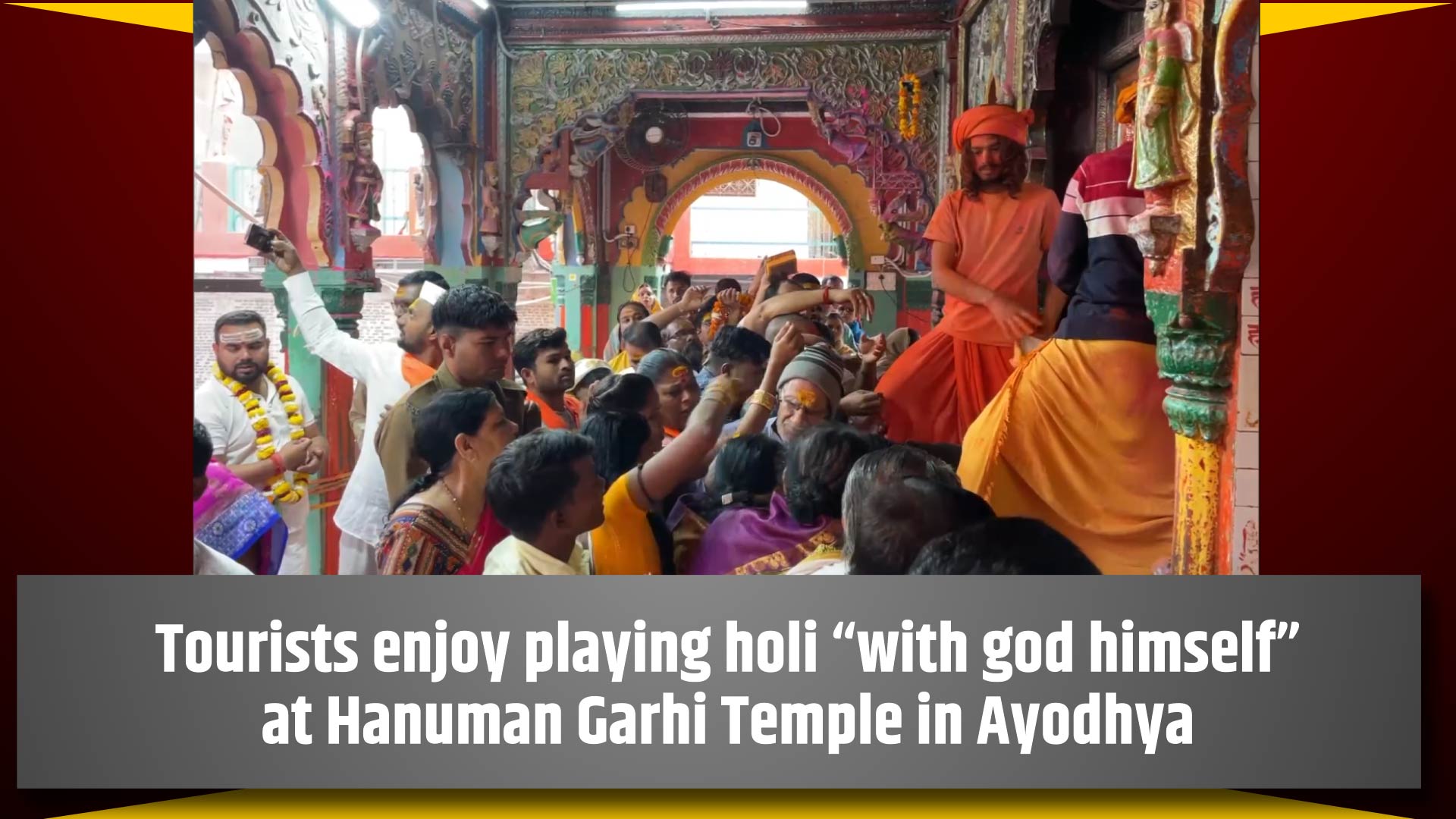 Tourists enjoy playing holi `with god himself` at Hanuman Garhi Temple in Ayodhya