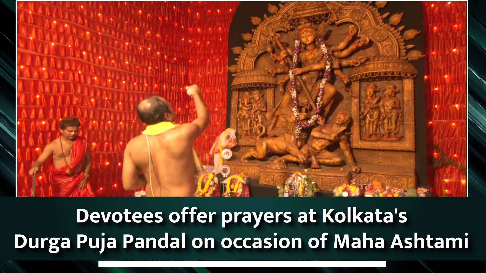 Devotees offer prayers at Kolkata`s Durga Puja Pandal on occasion of Maha Ashtami